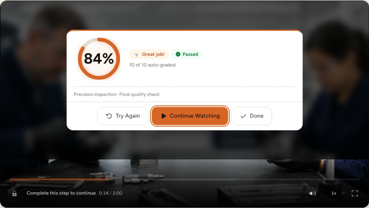 A centered Interakly final result showing an 84 percent passing score over a precision manufacturing training scene